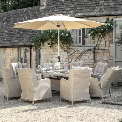 Bramblecrest Chedworth 220 x 145cm Elliptical Table, 60cm L/S, 8 Armchairs & Parasol -