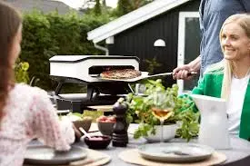 Cozze® 13" electric pizza oven with pizza stone and front do